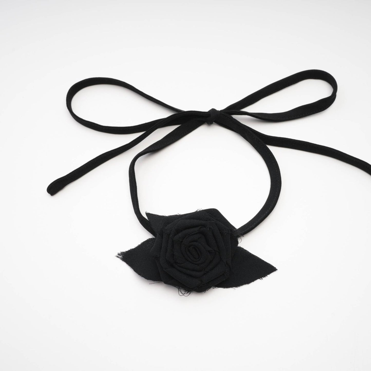 Black dress with spaghetti straps square neck floral cut rear zip fastening and flower decoration at the neck Asymmetric design made of 80% Polyester and 20% Cotton