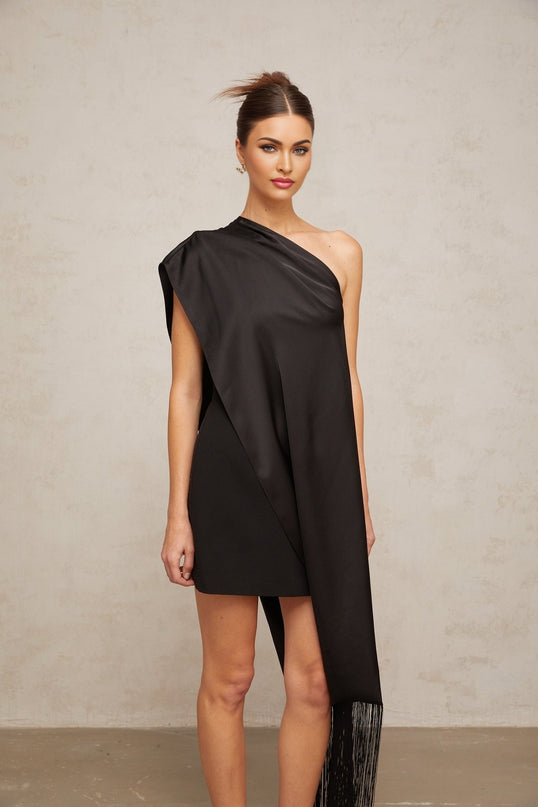 A black mini dress with a single shoulder strap suitable for Valentines Day featuring a sleek and stylish design