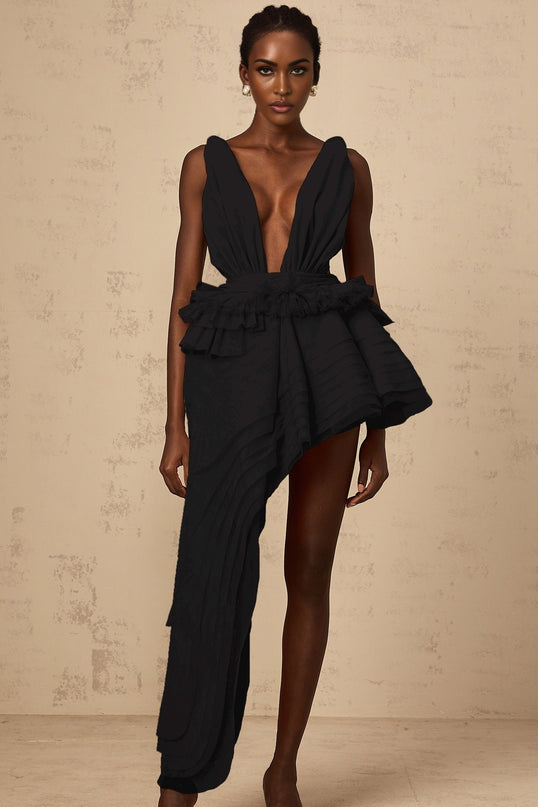 A black mini dress with an asymmetrical hemline featuring a decorative ribbon design by Isoline