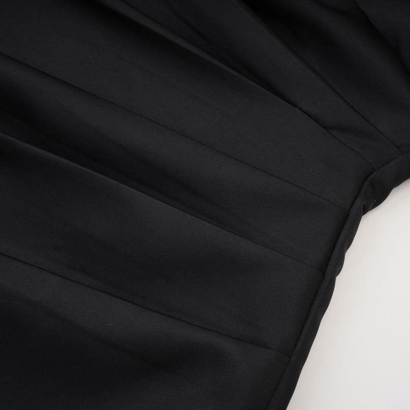 A black mini dress with crystal embellishments named Emmeline featuring a short hemline and sparkling details