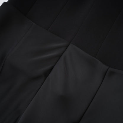 Black sleeveless dress with spaghetti straps square neck draped design rear zip fastening and mini length Made of 80% Polyester 20% Cotton