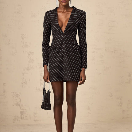 A black mini dress with embellished stripes and a short hemline featuring the name Mireille