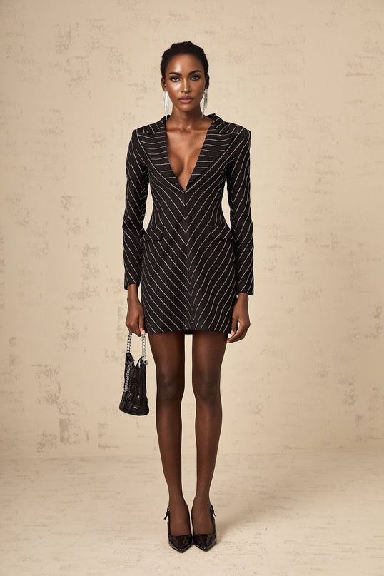 A black mini dress with embellished stripes and a short hemline featuring the name Mireille