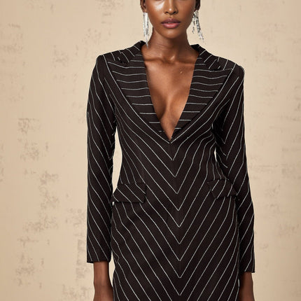 A black mini dress with embellished stripes named Mireille featuring a short length and decorative detailing