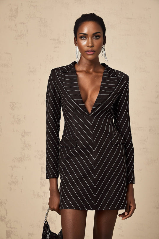 A black mini dress with embellished stripes named Mireille featuring a short length and decorative detailing