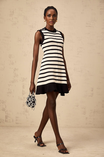A black mini dress with horizontal stripes in a knit fabric The dress features a simple design and a short length