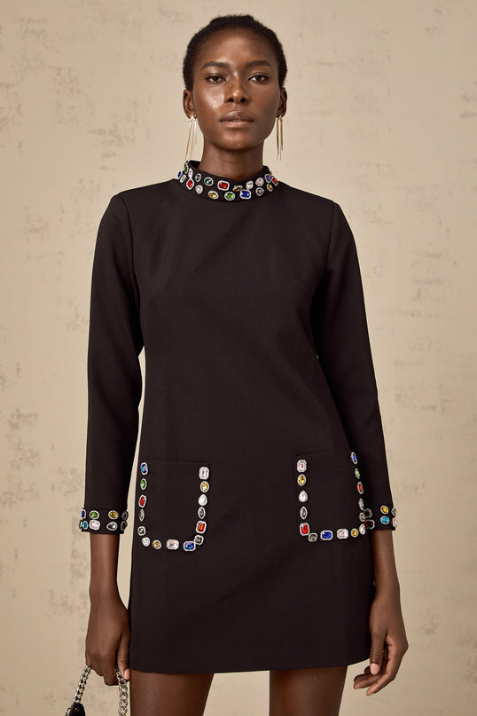 A black mini dress with long sleeves adorned with crystal embellishments named Juliette