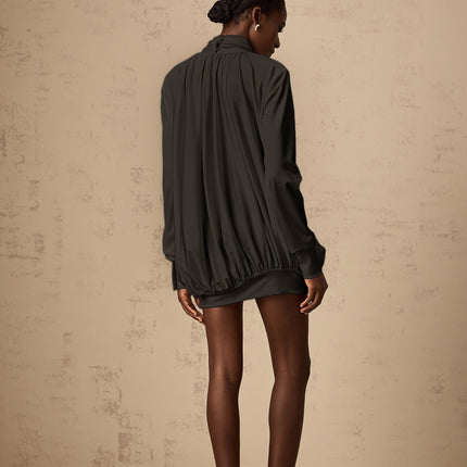 A black mini dress with ruched detailing and faux flower embellishments named Maeva