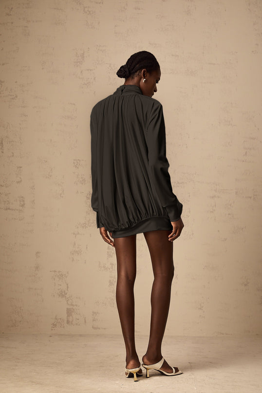 A black mini dress with ruched detailing and faux flower embellishments named Maeva