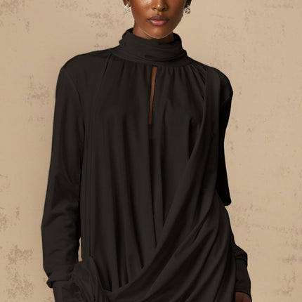 A black mini dress with ruched detailing and faux flower embellishments