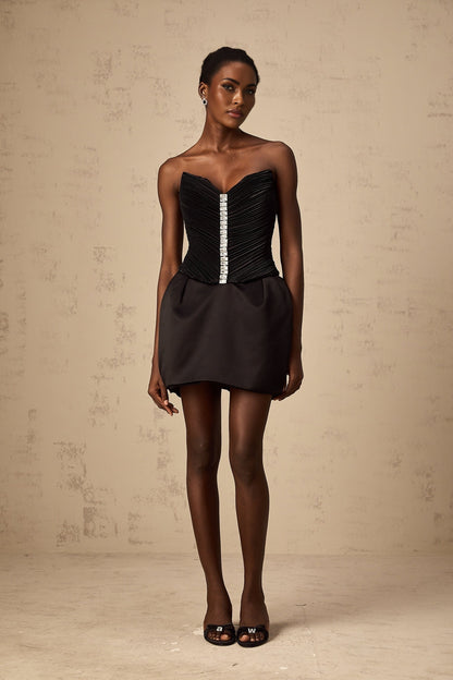 A black mini dress with ruched detailing and puff sleeves named Francis