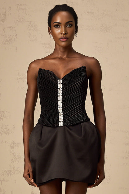 A black mini dress with ruched detailing and puff sleeves named Francis