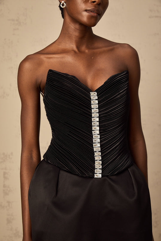 A black mini dress with ruched detailing and puff sleeves named Francis