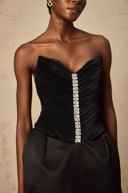A black mini dress with ruched detailing and puff sleeves named Francis