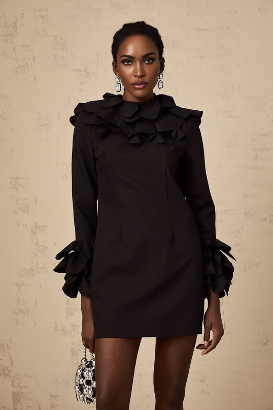 A black mini dress with ruffled details and an open back design named Jacques