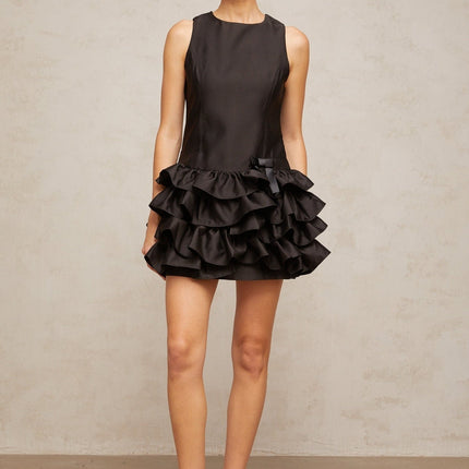 A black mini dress with ruffled tiers and a short hemline named Therese
