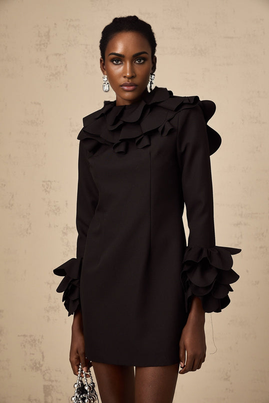 A black mini dress with ruffles and an open back design named Jacques