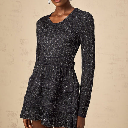 A black mini dress with sequin embellishments and a knitted texture featuring a short hemline and likely formfitting silhouette