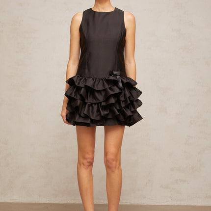 A black mini dress with tiered ruffles and a short hemline named Therese