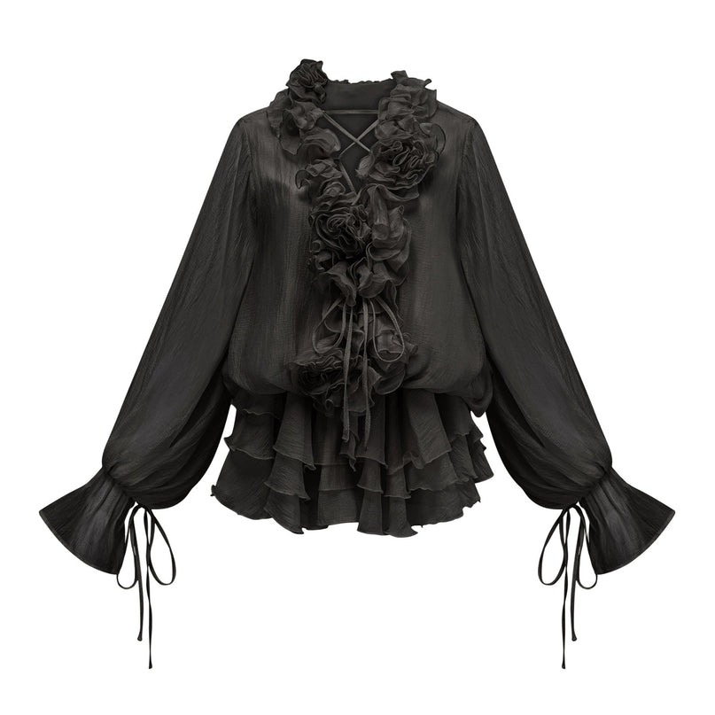 A black mini dress with tiered skirt and floral applique details called Zephyrine