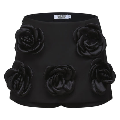 Black thighlength dress with fauxflower adornment and side zip closure made of 100% Acetate fiber