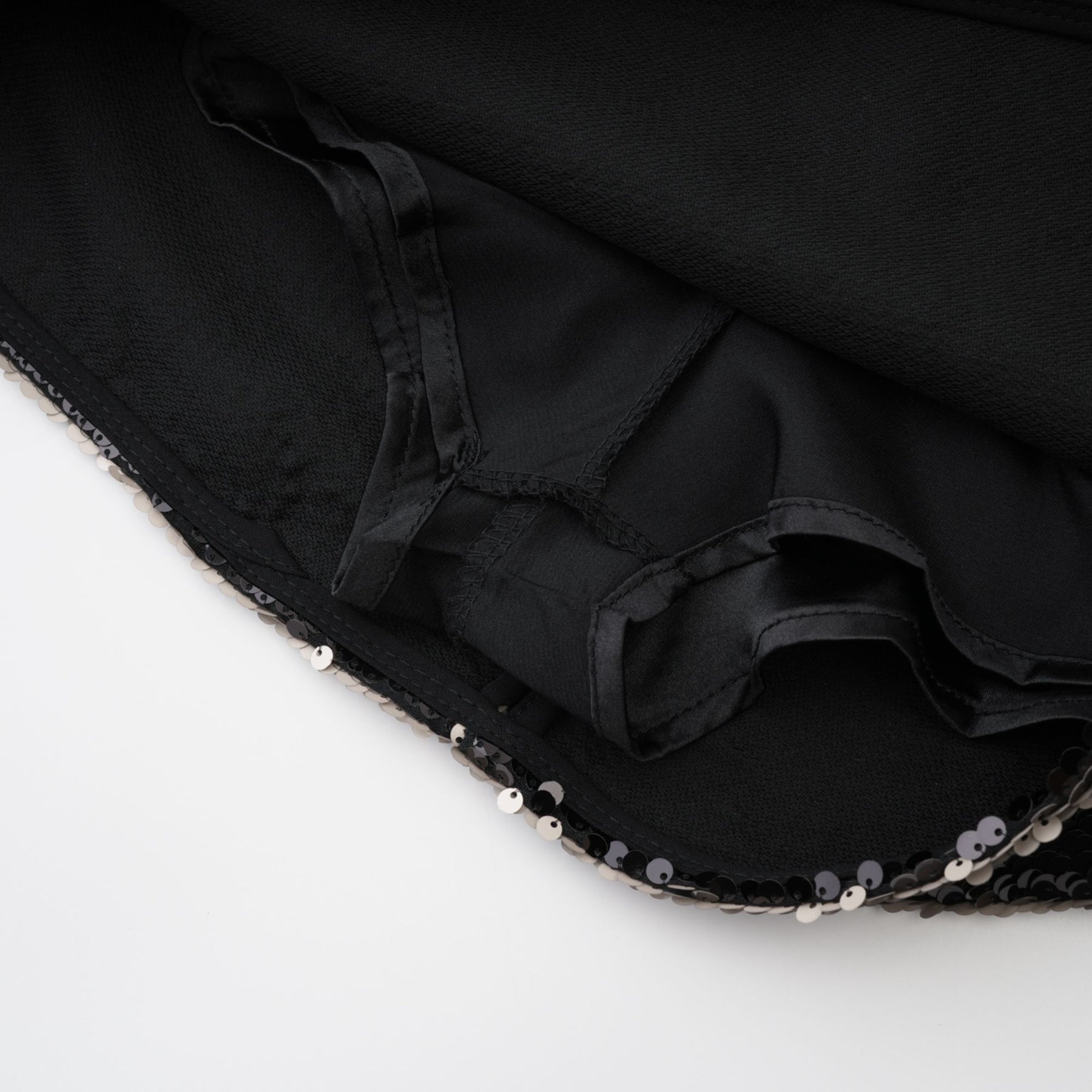 Black dress with sparkling finish adorned with sequins rear zip closure straight hem thighlength 100% Polyester composition