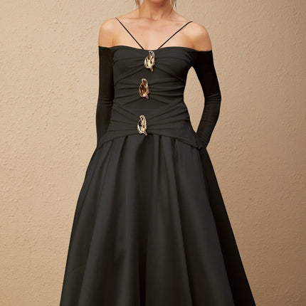 A black offshoulder maxi dress with panelled design worn by a model named Nadine