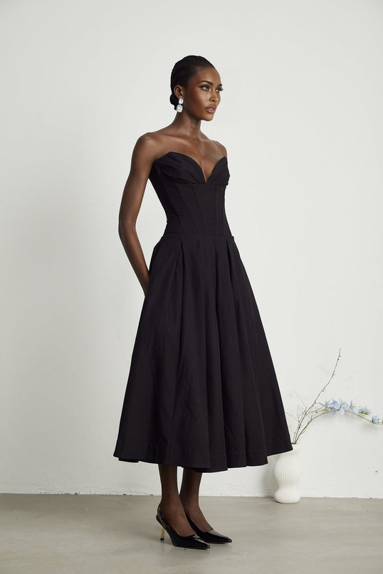 A black offshoulder midi dress with a corsetstyle bodice named Katherine