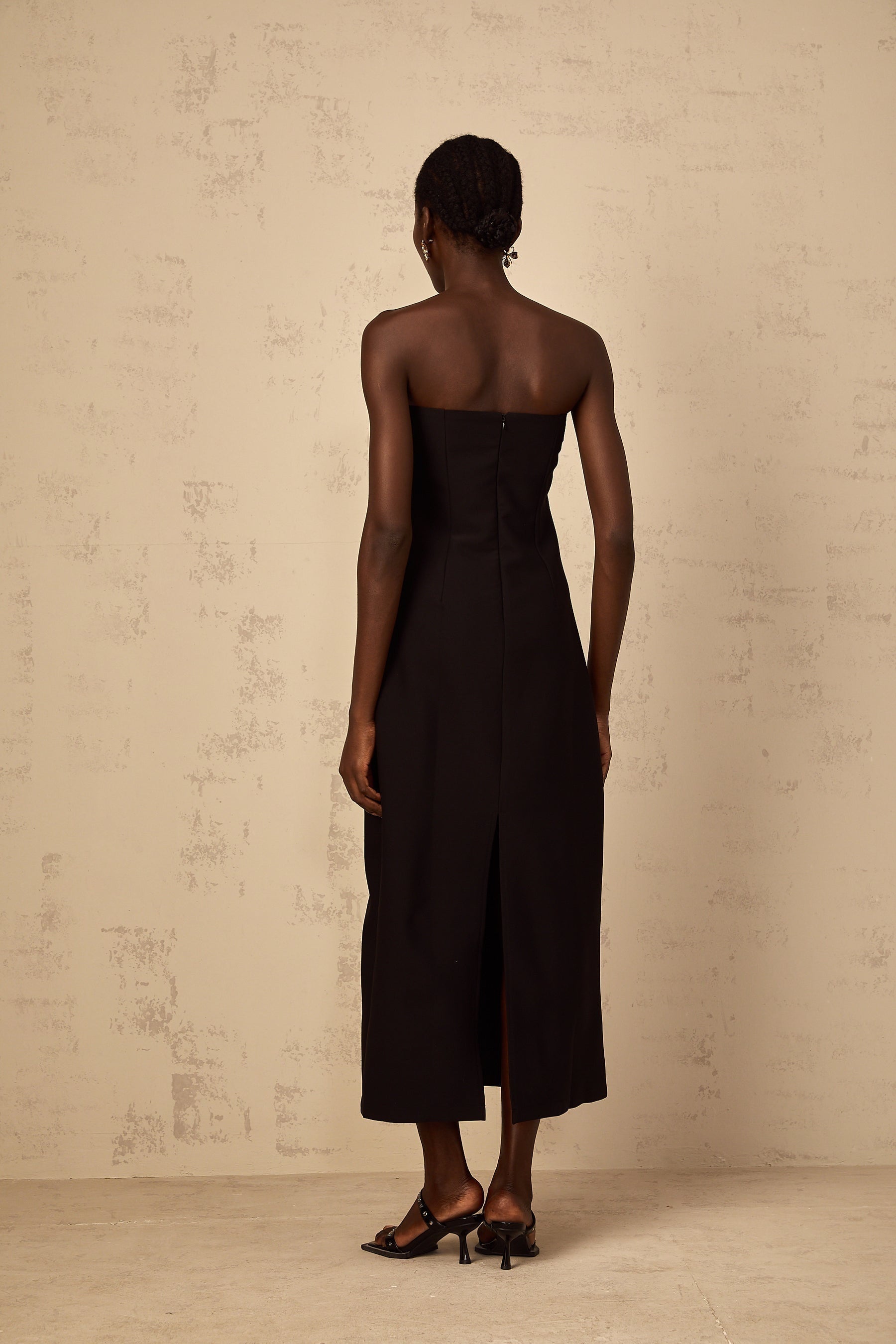 A black offshoulder midi dress with sequin embroidery named Irene featuring a fitted silhouette and elegant design