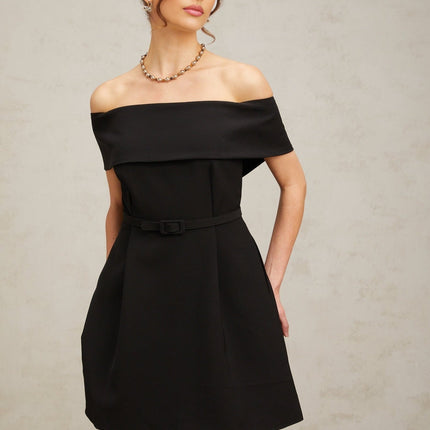 A black offshoulder mini dress with a belt at the waist named Greta