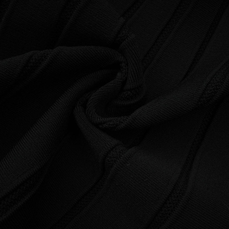 A black offshoulder mini dress with a knit texture and a bow detail