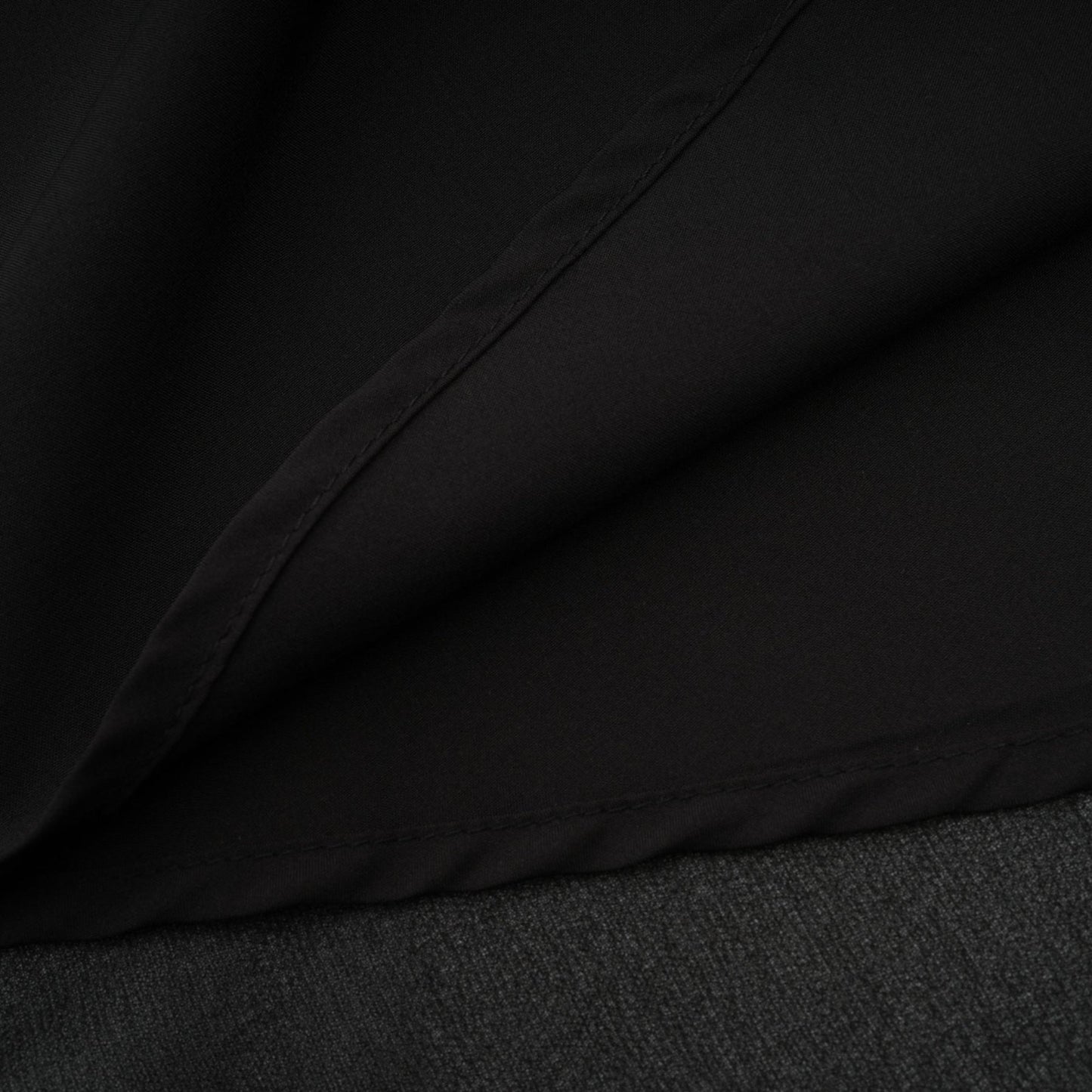 A black pleated midi dress with a button front closure featuring the name Viviane