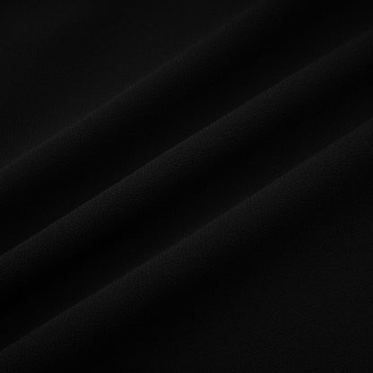 A black pleated midi dress with a button front closure named Viviane