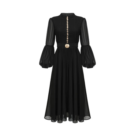 A black pleated midi dress with a buttonfront design featuring long sleeves and a flowing silhouette