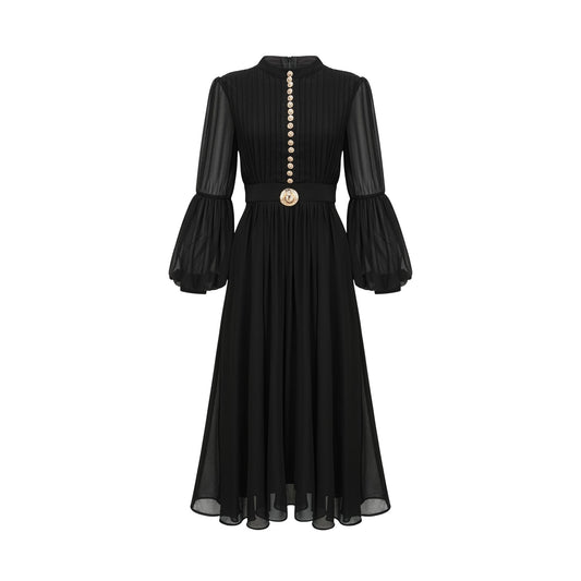 A black pleated midi dress with a buttonfront design featuring long sleeves and a flowing silhouette