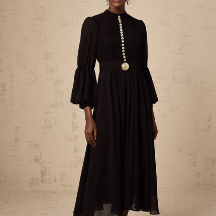 A black pleated midi dress with a buttonfront design featuring the name Viviane