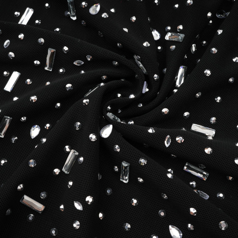 A black semi sheer maxi dress with embellishments named Léna