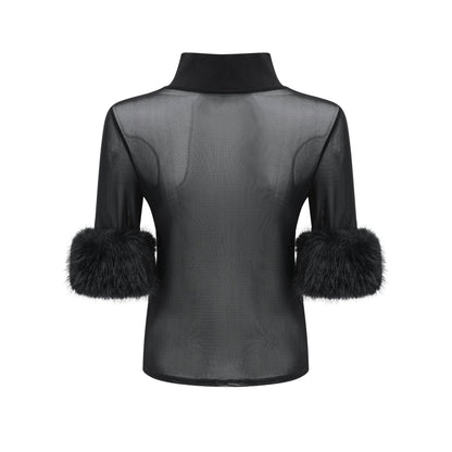 A black sleeveless top with a faux fur bodice and sheer tulle overlay creating a luxurious contrast in textures