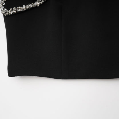 Black spaghetti strap dress with crystal and faux pearl embellishments ruffled details and a rear zip fastening