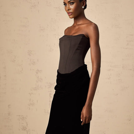 A black velvet maxi dress with an offshoulder neckline called Aurore