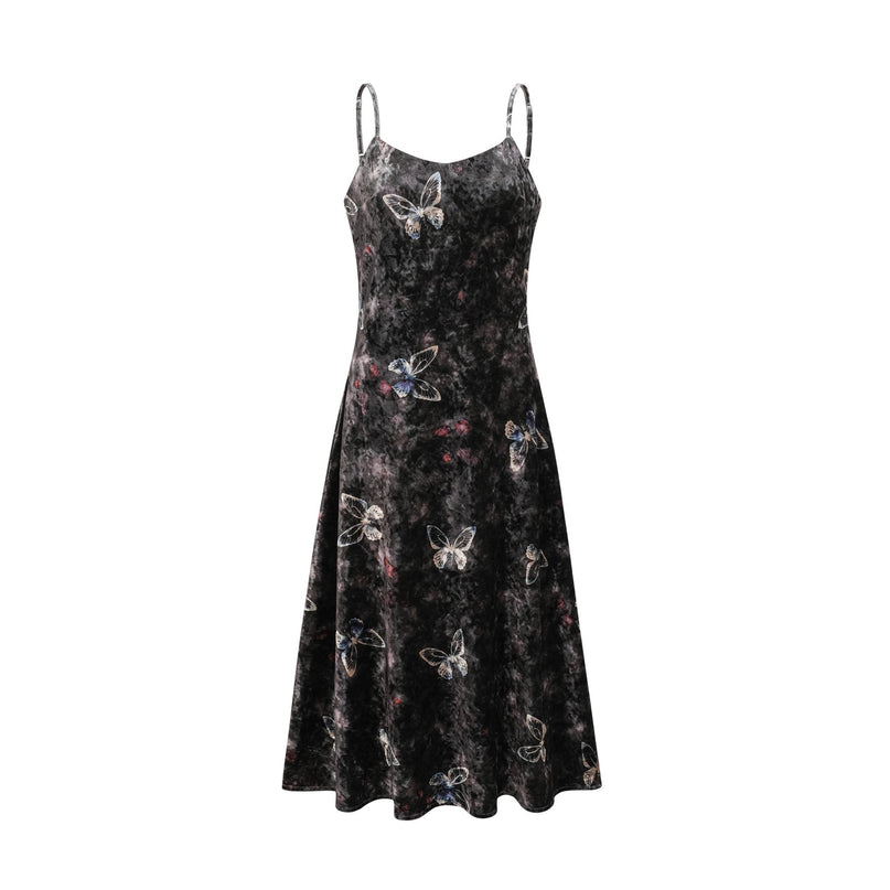 A black velvet midi dress with a butterfly print pattern worn by a model standing against a plain background
