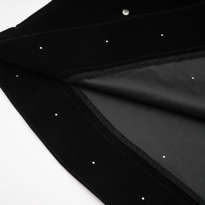 A black velvet midi dress with embellishments named Lola featuring a sleek silhouette and elegant design