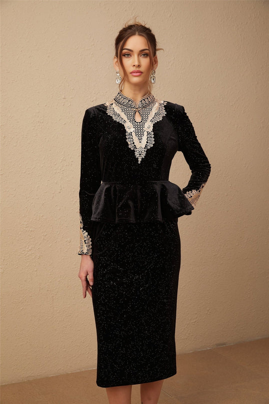 A black velvet midi dress with embellishments named Roxane featuring a sleek design and elegant details