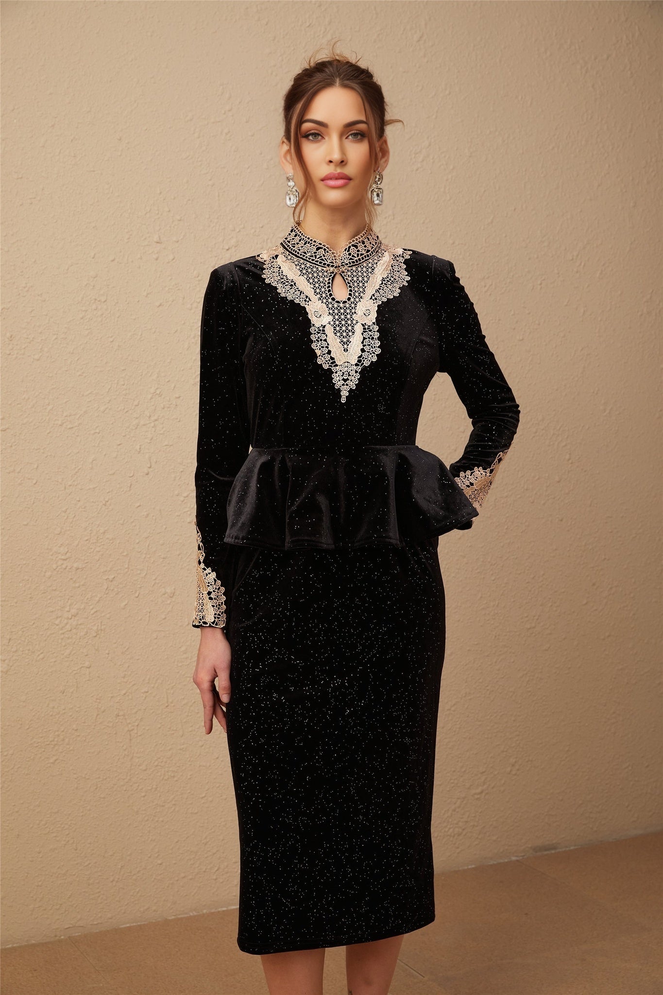 A black velvet midi dress with embellishments named Roxane featuring a sleek design and elegant details