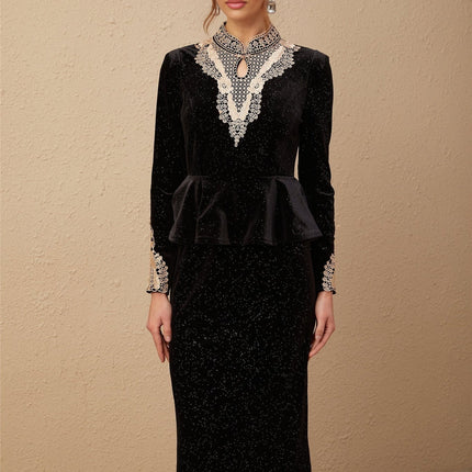 A black velvet midi dress with embellishments named Roxane featuring a sleek silhouette and elegant design