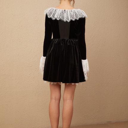 A black velvet mini dress with lace trim details named Fabiana