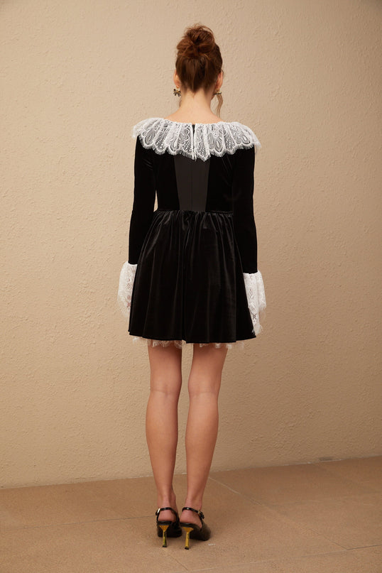 A black velvet mini dress with lace trim details named Fabiana