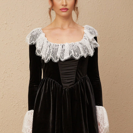 A black velvet mini dress with lace trim details named Fabiana