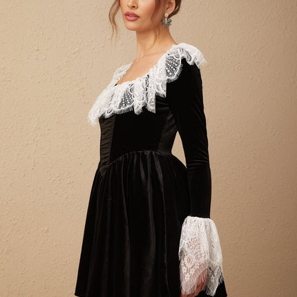 A black velvet mini dress with lace trim details