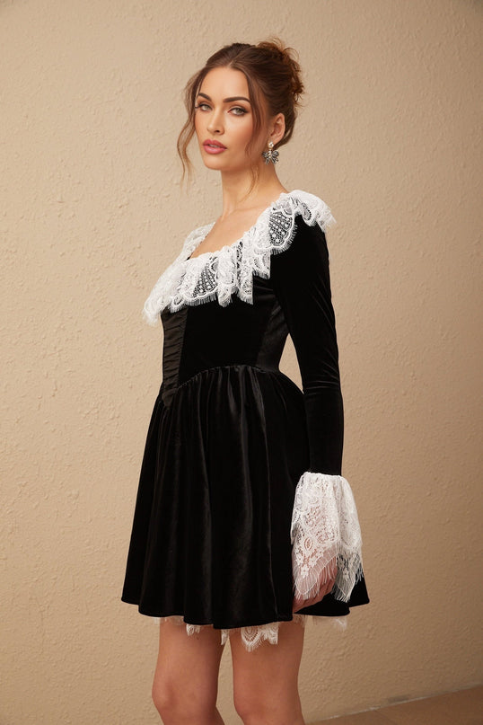 A black velvet mini dress with lace trim details